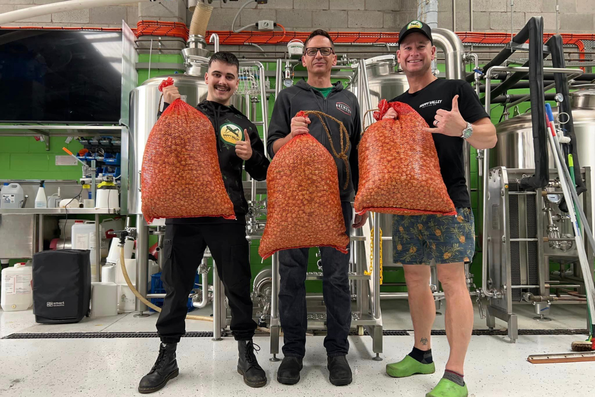 Jett with his two mentors, Ian Watson and Cheyne Meehan - and some big 'ol bags of hop cones.